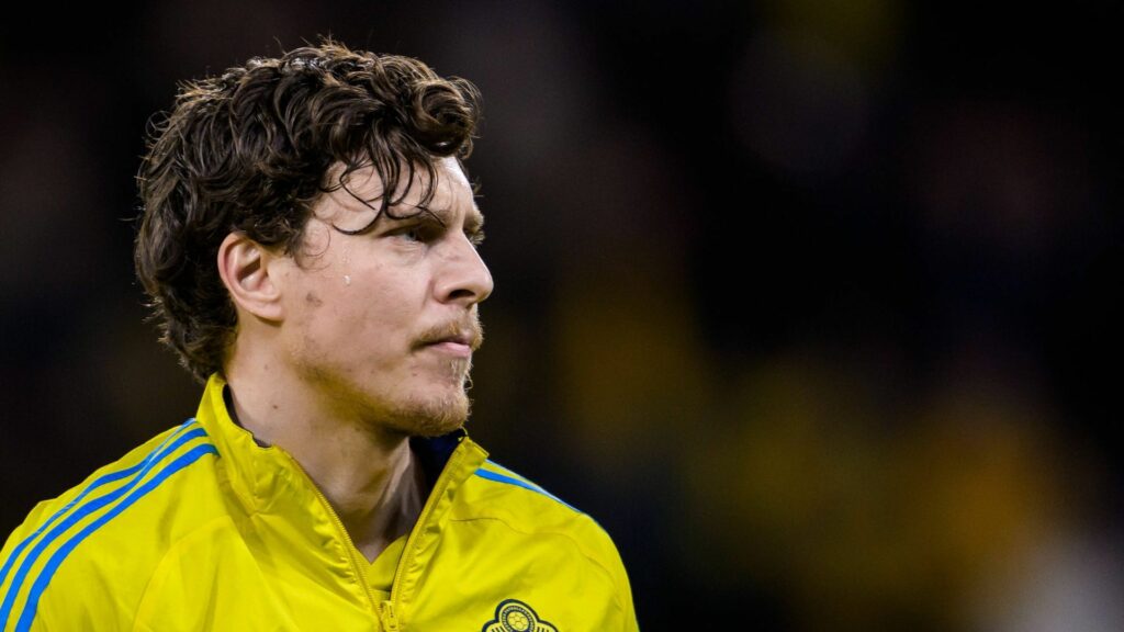 Aston Villa defender Victor Lindelof stands wearing a Sweden anthem jacket.
